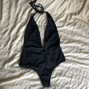 Low cut backless one piece